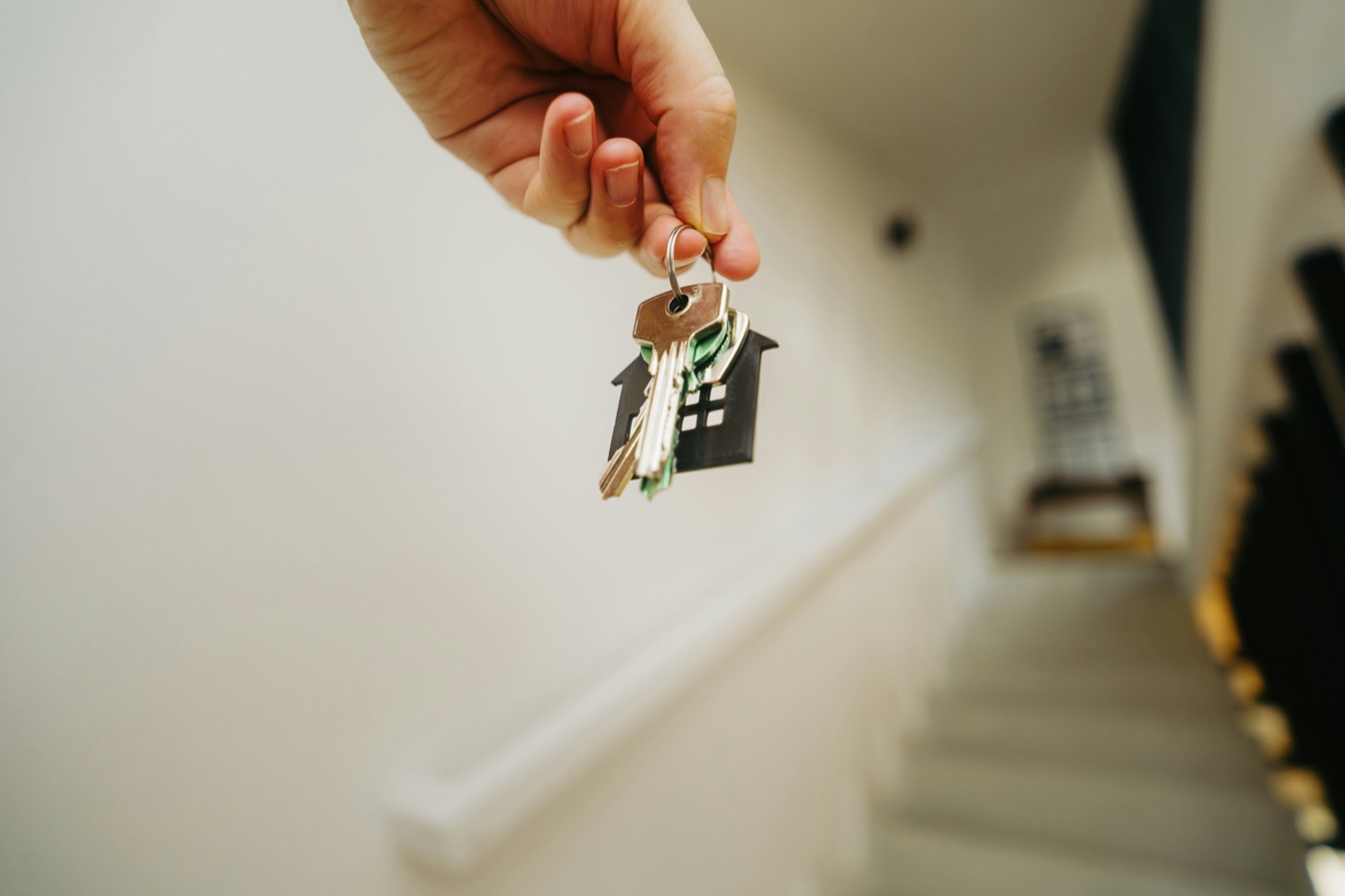 Hand holding keys to a new home